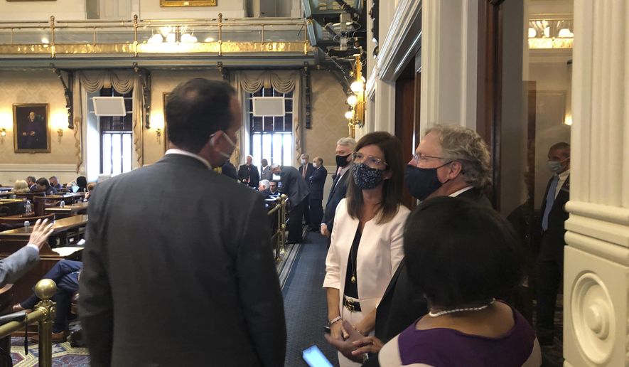 South Carolina Lt. Gov. Pamela Evette, center, speaks to House members during the session Tuesday, Sept. 22, 2020, at the Statehouse in Columbia, South Carolina. It was Evette's first public appearance since being diagnosed with COVID-19 on Sept. 11, 2020. (AP Photo/Jeffrey Collins)