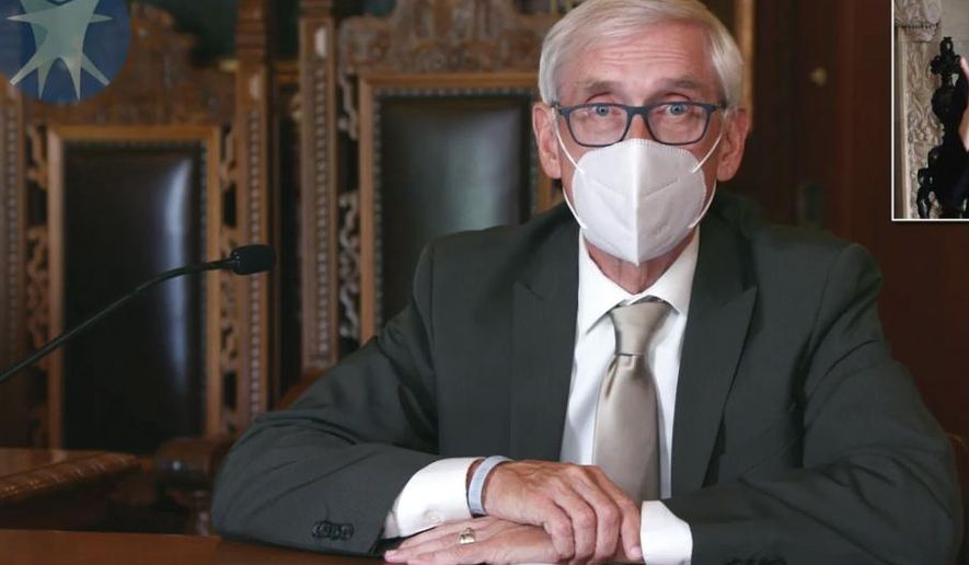 FILE - This July 30, 2020 image taken from video by the Wisconsin Department of Health Services shows Wisconsin Gov. Tony Evers in Madison, Wis. Faced with soaring coronavirus cases across Wisconsin, particularly on college campuses, Evers on Tuesday, Sept. 22, extended a statewide mask mandate until Nov. 21. (Wisconsin Department of Health Services via the AP, File)