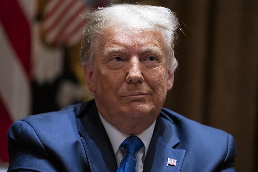 President Donald Trump listens as Attorney General William Barr speaks during a meeting with Republican state attorneys general about social media companies, in the Cabinet Room of the White House, Wednesday, Sept. 23, 2020, in Washington. (AP Photo/Evan Vucci)