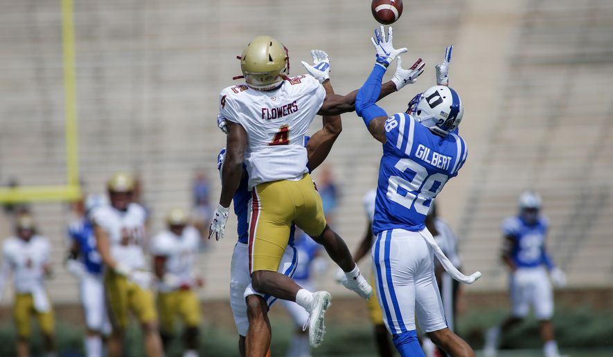 Duke cornerback Mark Gilbert (28) intercepts a pass intended for Boston College wide receiver Zay Flowers (4) during the first half of an NCAA college football game, Saturday, Sept. 19, 2020, in Durham, N.C. (Nell Redmond/Pool Photo via AP)