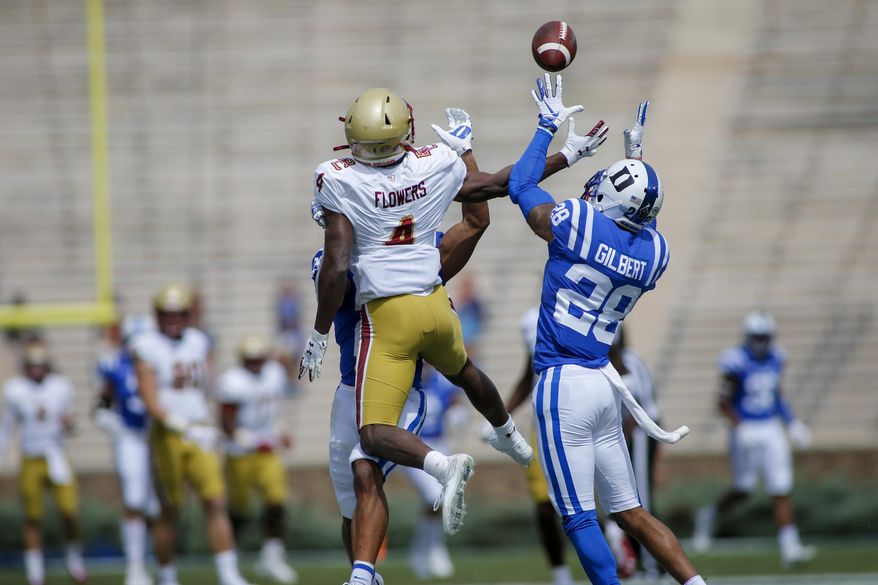 Duke cornerback Mark Gilbert (28) intercepts a pass intended for Boston College wide receiver Zay Flowers (4) during the first half of an NCAA college football game, Saturday, Sept. 19, 2020, in Durham, N.C. (Nell Redmond/Pool Photo via AP)
