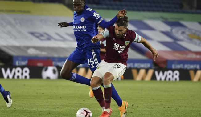 Leicester&#x27;s Wilfred Ndidi, left, vie for the ball with Burnley&#x27;s Jay Rodriguez during the English Premier League soccer match between Leicester City and Burnley at the King Power Stadium, Leicester, England, Sunday, Sept. 20, 2020. (AP Photo/Rui Vieira, Pool)