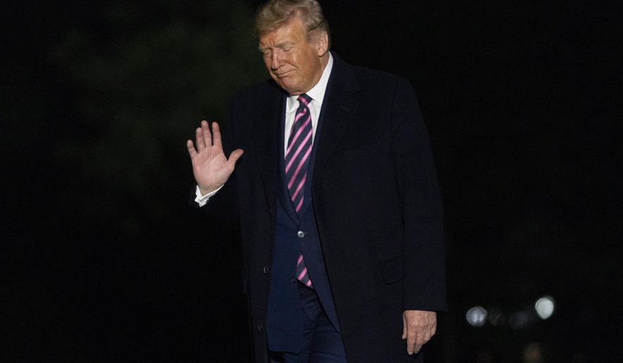 President Donald Trump arrives at the White House in Washington, late Tuesday, Sept. 22, 2020, following a short trip from Andrews Air Force Base, Md., after attending a rally in Pittsburgh. (AP Photo/Andrew Harnik)