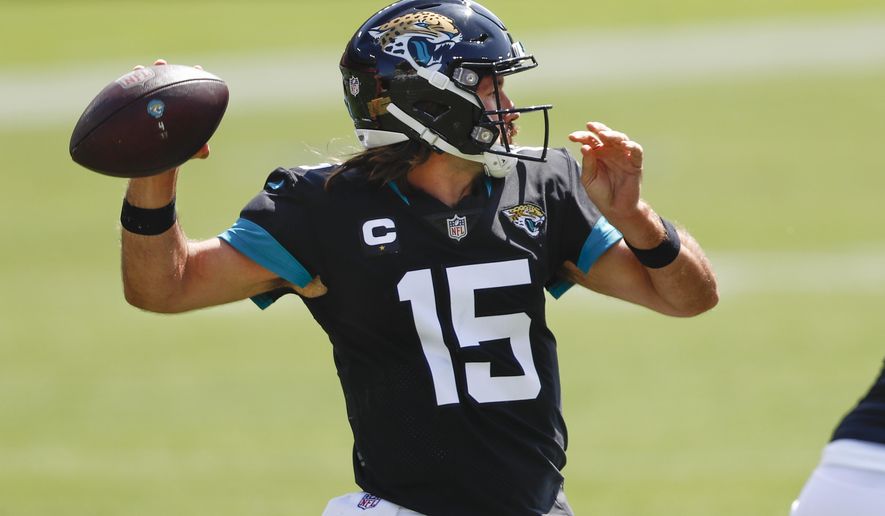 Jacksonville Jaguars quarterback Gardner Minshew (15) passes against the Tennessee Titans in the first half of an NFL football game Sunday, Sept. 20, 2020, in Nashville, Tenn. (AP Photo/Wade Payne)