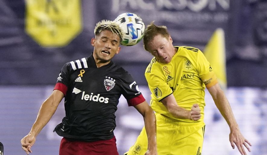 D.C. United midfielder Yamil Asad (11) and Nashville SC midfielder Dax McCarty (6) head the ball during the first half of an MLS soccer match Wednesday, Sept. 23, 2020, in Nashville, Tenn. (AP Photo/Mark Humphrey)  **FILE**