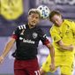 D.C. United midfielder Yamil Asad (11) and Nashville SC midfielder Dax McCarty (6) head the ball during the first half of an MLS soccer match Wednesday, Sept. 23, 2020, in Nashville, Tenn. (AP Photo/Mark Humphrey)  **FILE**
