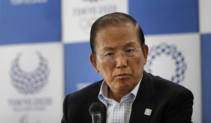 In this June 11, 2019, file photo, Toshiro Muto, CEO of the 2020 Tokyo Olympics organizing committee, listens to questions from the media during a news conference in Tokyo. Tokyo CEO Muto and other Olympic officials are proposing that the government relax immigration regulations, allowing athletes to enter the country before next year’s postponed games and train during a 14-day quarantine period. (AP Photo/Jae C. Hong, File)  **FILE**