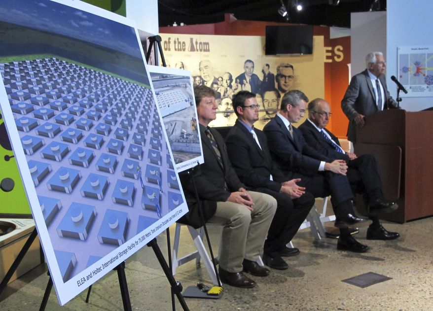 FILE - In this April 29, 2015, file photo, an illustration depicts a planned interim storage facility for spent nuclear fuel in southeastern New Mexico as officials announce plans to pursue the project during a news conference in Albuquerque, N.M. The state of New Mexico is strongly objecting to a recommendation by federal nuclear regulators that a license be granted to build a multibillion-dollar storage facility for spent nuclear fuel from commercial power plants around the U.S. State officials in a letter submitted Tuesday, Sept. 22, 2020, to the Nuclear Regulatory Commission said the site is geologically unsuitable and regulators have failed to consider environmental justice concerns. (AP Photo/Susan Montoya Bryan, File)