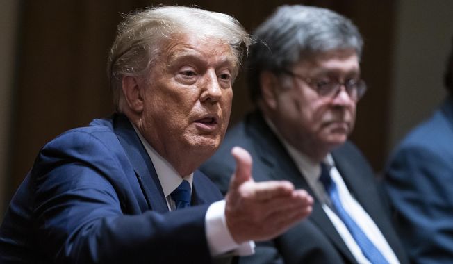 Attorney General William Barr listens as President Donald Trump speaks during a meeting with Republican state attorneys general about social media companies, in the Cabinet Room of the White House, Wednesday, Sept. 23, 2020, in Washington. (AP Photo/Evan Vucci) ** FILE **