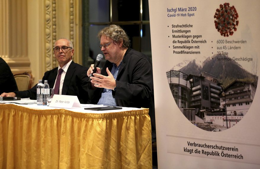 Attorney Alexander Klauser and chairman of the consumer protection association Peter Kolba, from left, speake during a joint press conference of a class action lawsuit against the Tirol regional authorities for failing in their public health duties, related to the virus outbreak in the ski-resort of Ischgl, seen as a key location from which the virus spread across Europe, in Vienna, Austria, Wednesday, Sept. 23, 2020. (AP Photo/Ronald Zak)