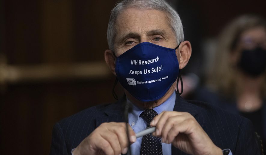 Dr. Anthony Fauci, Director of the National Institute of Allergy and Infectious Diseases at the National Institutes of Health, listens during a Senate Senate Health, Education, Labor, and Pensions Committee Hearing on the federal government response to COVID-19 Capitol Hill on Wednesday, Sept. 23, 2020, in Washington. (Graeme Jennings/Pool via AP) ** FILE **