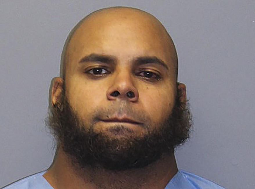 This booking photo provided by the South Windsor Police, shows Alan Rosario, 33, of Springfield, Massachusetts, charged in connection with the workplace shooting that happened in South Windsor, Connecticut, on Tuesday, Sept. 22, 2020. Rosario was extradited from Massachusetts to Connecticut on Wednesday and was charged with assault amongst other charges, Wednesday, Sept. 23, 2020, in South Windsor, Conn. (South Windsor Police via AP)