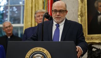 In this file photo, syndicated radio host Mark Levin speaks, with President Donald Trump behind him, during a ceremony to present the Presidential Medal of Freedom to former Attorney General Edwin Meese, in the Oval Office of the White House, Tuesday, Oct. 8, 2019, in Washington. Mr. Levin is among a number of high-profile conservatives to slam major news organizations for calling the presidential election on Nov. 7, 2020, despite ongoing vote counts and legal challenges in various states. (AP Photo/Alex Brandon) **FILE**
