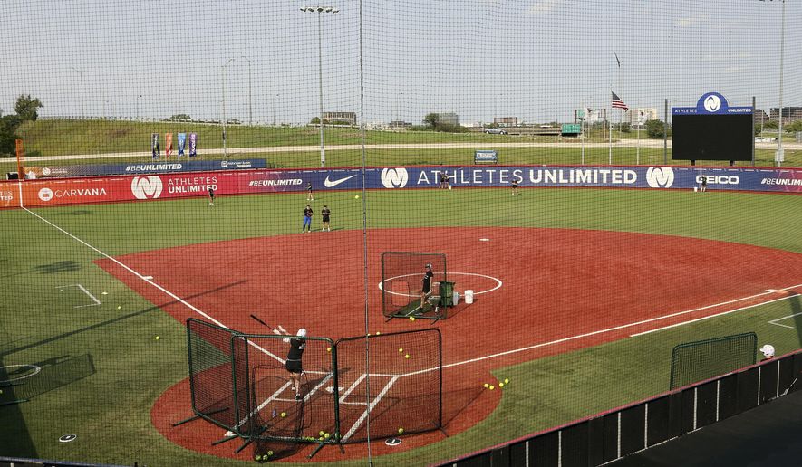 Players for Athletes Unlimited practice on Wednesday, Sept. 16, 2020, in Rosemont, Ill. Elite players are living life in a bubble to prevent the spread of COVID during the inaugural Athletes Unlimited softball season. When they're not at the ballpark or an indoor facility across the parking lot, they are at their hotel or apartment. Everywhere else is off limits to them. (AP Photo/Teresa Crawford)
