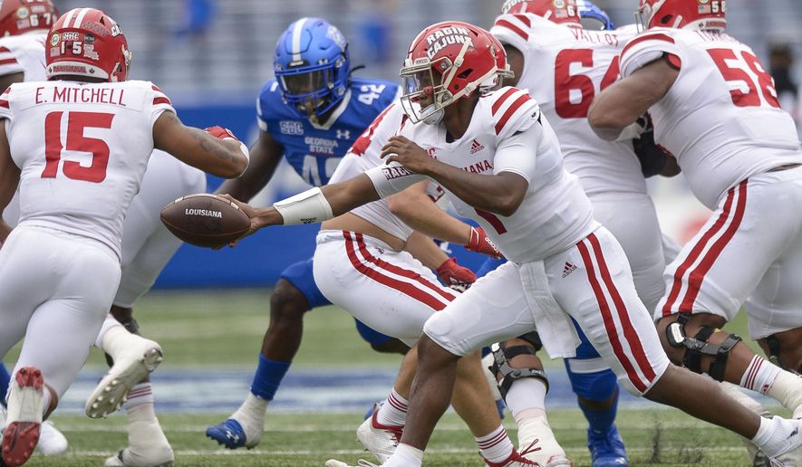 Louisiana-Lafayette quarterback Levi Lewis (1) makes a handoff in the first half of his game against Georgia State in an NCAA college football game, Saturday, Sept. 19, 2020, in Atlanta. (Daniel Varnado/Atlanta Journal-Constitution via AP)