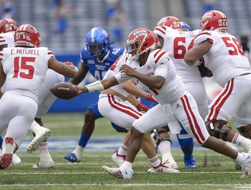 Louisiana-Lafayette quarterback Levi Lewis (1) makes a handoff in the first half of his game against Georgia State in an NCAA college football game, Saturday, Sept. 19, 2020, in Atlanta. (Daniel Varnado/Atlanta Journal-Constitution via AP)