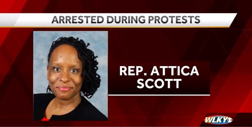Kentucky state Rep. Attica Scott was arrested and charged with felony rioting Thursday night during a second night of violent protests sparked by the grand jury decision in the Breonna Taylor case. (Screengrab via WLKY)