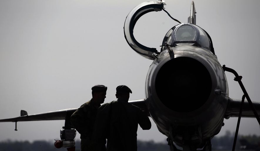 FILE - In this Wednesday, April 6, 2016 file photo, ground crew prepares a Mig 21 fighter jet for a flight at the military airport Batajnica, near Belgrade, Serbia. Serbia's defense ministry says that a military jet has crashed near the country's border with Bosnia. The statement says that the accident happened around 9a.m. (0700GMT) on Friday, Sept. 25, 2020. (AP Photo/Darko Vojinovic, File)