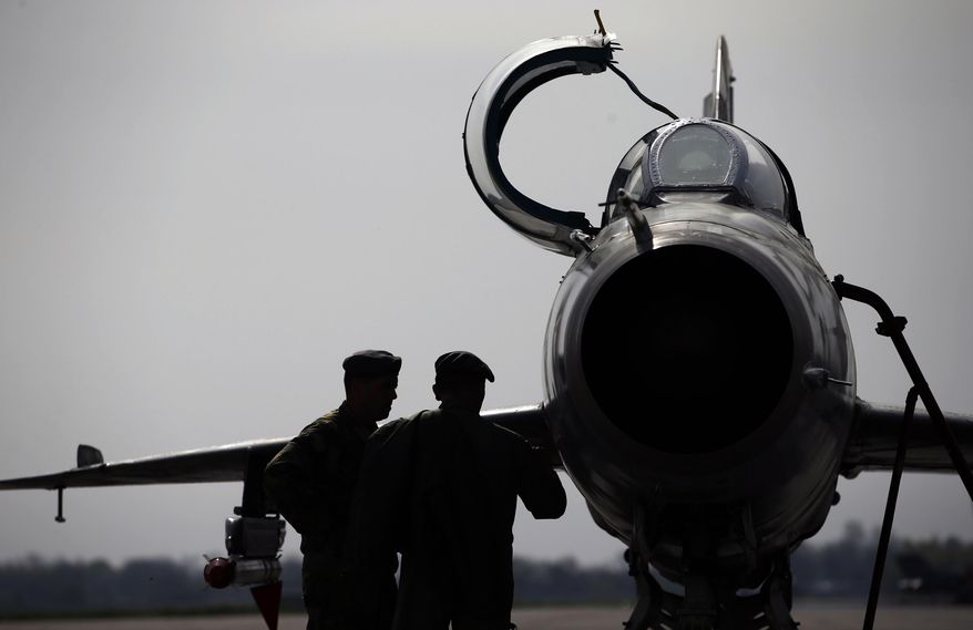 FILE - In this Wednesday, April 6, 2016 file photo, ground crew prepares a Mig 21 fighter jet for a flight at the military airport Batajnica, near Belgrade, Serbia. Serbia's defense ministry says that a military jet has crashed near the country's border with Bosnia. The statement says that the accident happened around 9a.m. (0700GMT) on Friday, Sept. 25, 2020. (AP Photo/Darko Vojinovic, File)