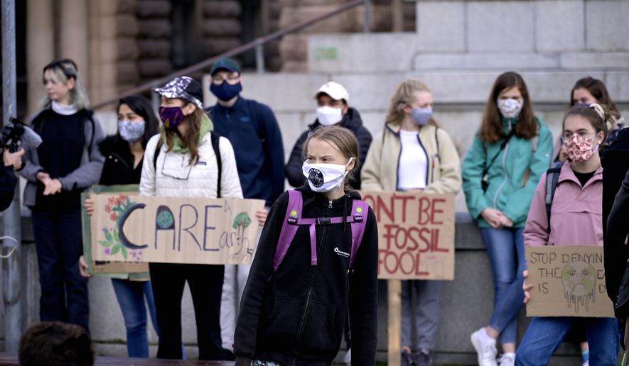 Swedish climate activist Greta Thunberg and others protest in front of the Swedish Parliament Riksdagen in Stockholm Friday, Sept. 25, 2020. ( Janerik Henriksson/TT News Agency via AP)