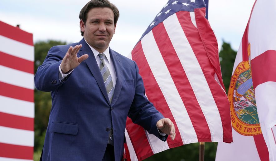 Florida Gov. Ron DeSantis attends an event with President Donald Trump on the environment at the Jupiter Inlet Lighthouse and Museum, Tuesday, Sept. 8, 2020, in Jupiter, Fla. (AP Photo/Evan Vucci)