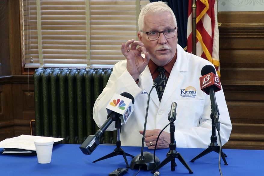 Dr. Lee Norman, the top administrator at the Kansas Department of Health and Environment, discusses the coronavirus pandemic during a news conference, Wednesday, Sept. 23, 2020, at the Statehouse in Topeka, Kan. Norman says community outbreaks in all parts of Kansas, even sparsely populated rural counties, are fueling continuing increases in coronavirus cases. (AP Photo/John Hanna)