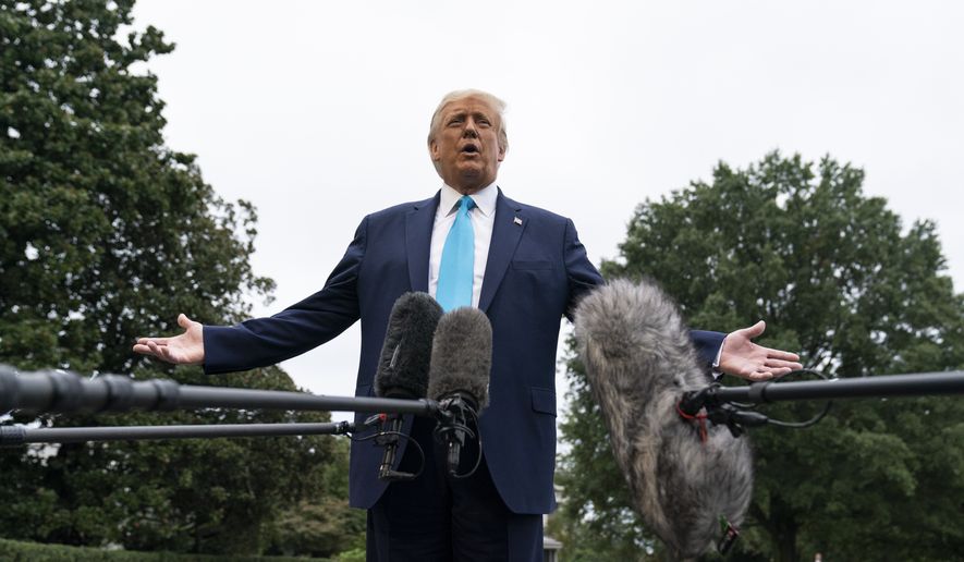 President Donald Trump speaks with reporters as he walks to Marine One on the South Lawn of the White House, Saturday, Sept. 26, 2020, in Washington, before departing for a campaign rally in Middletown, Pa. (AP Photo/Alex Brandon)