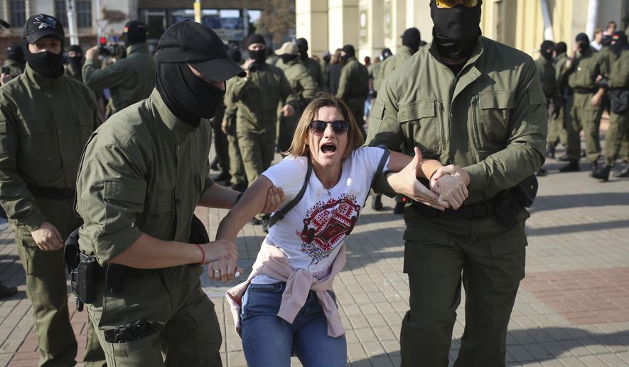 Police detain a protester during an opposition rally to protest the official presidential election results in Minsk, Belarus, Saturday, Sept. 26, 2020. Hundreds of thousands of Belarusians have been protesting daily since the Aug. 9 presidential election. (AP Photo/TUT.by)