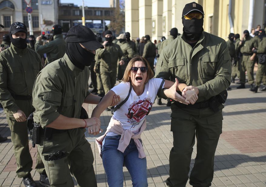 Police detain a protester during an opposition rally to protest the official presidential election results in Minsk, Belarus, Saturday, Sept. 26, 2020. Hundreds of thousands of Belarusians have been protesting daily since the Aug. 9 presidential election. (AP Photo/TUT.by)