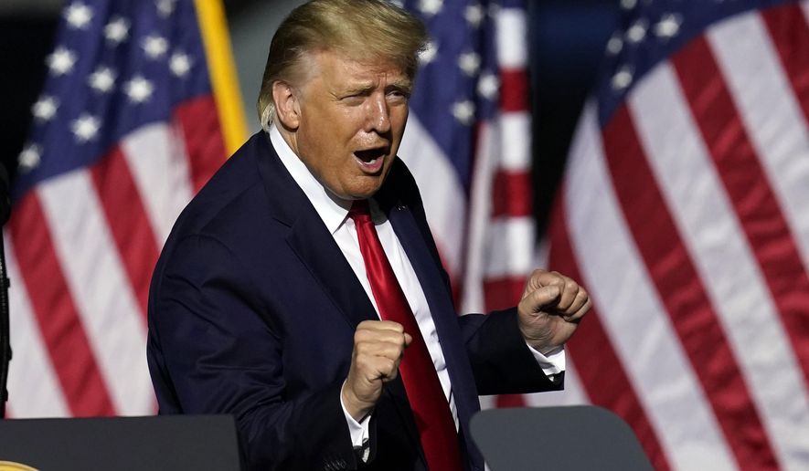 President Donald Trump does a little dance after speaking at a campaign rally Friday, Sept. 25, 2020, in Newport News, Va. (AP Photo/Steve Helber)