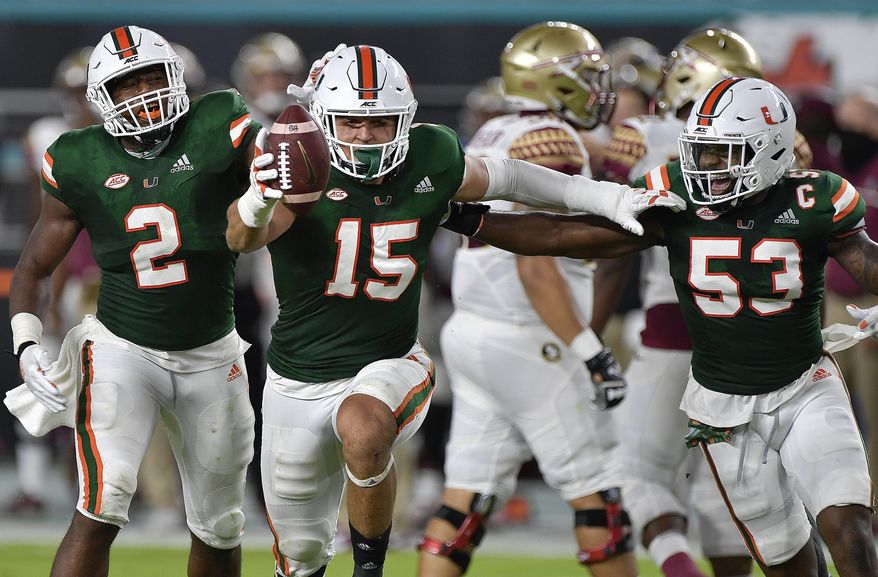 Miami lineman Jaelan Phillips celebrates after intercepting a pass from Florida State during the first half of an NCAA college football game, Saturday, Sept. 26, 2020, in Miami Gardens, Fla. (Michael Laughlin/South Florida Sun-Sentinel via AP)