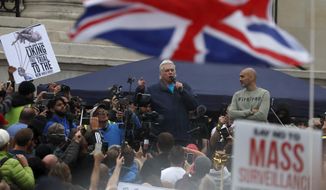 English conspiracy theorist David Icke speaks during a &#x27;We Do Not Consent&#x27; rally at Trafalgar Square, organised by Stop New Normal, to protest against coronavirus restrictions, in London, Saturday, Sept. 26, 2020. (AP Photo/Frank Augstein)