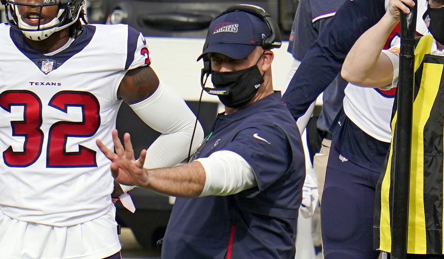 Houston Texans head coach Bill O'Brien, center, gives signals from the sideline during the second half of an NFL football game against the Pittsburgh Steelers in Pittsburgh, Sunday, Sept. 27, 2020. (AP Photo/Gene J. Puskar)
