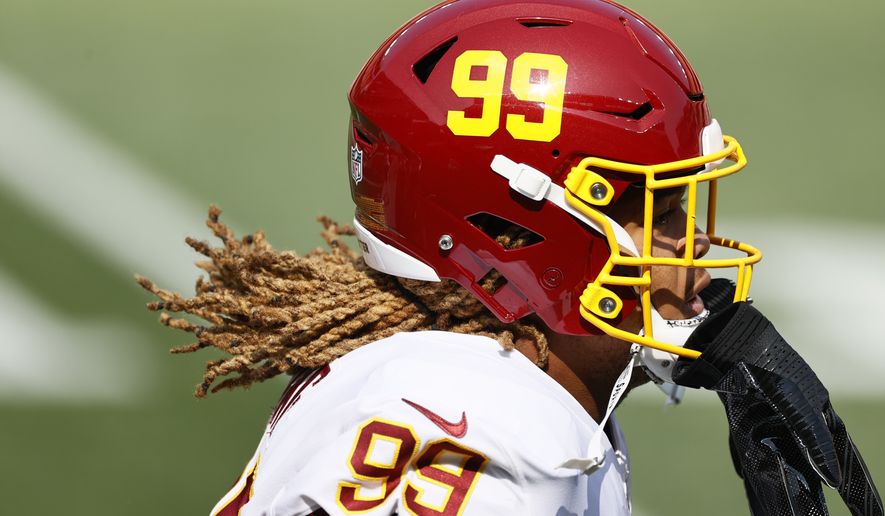 Washington Football Team defensive end Chase Young is shown before an NFL football game against the Cleveland Browns Sunday, Sept. 27, 2020, in Cleveland. (AP Photo/Ron Schwane)