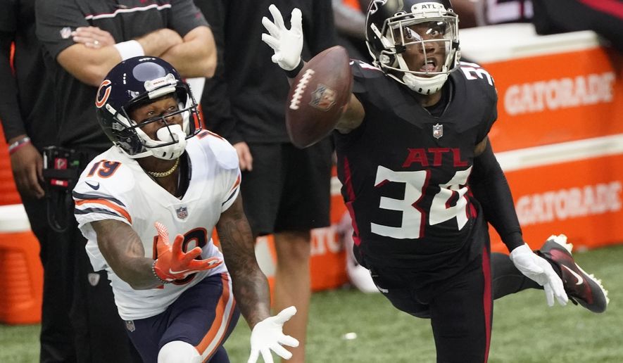 Atlanta Falcons defensive back Darqueze Dennard (34) misses the catch against Chicago Bears wide receiver Ted Ginn (19) during the first half of an NFL football game, Sunday, Sept. 27, 2020, in Atlanta. (AP Photo/John Bazemore)