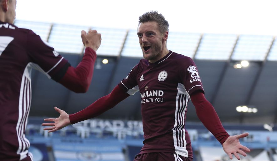 Leicester&#x27;s Jamie Vardy right, celebrates after scoring his sides second goal of the game with teammate Leicester&#x27;s Timothy Castagne during the English Premier League soccer match between Manchester City and Leicester City at the Etihad stadium in Manchester, England, Sunday, Sept. 27, 2020. (Catherine Ivill/Pool via AP)