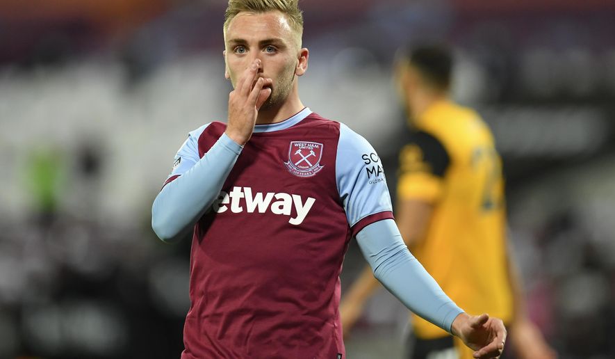 West Ham's Jarrod Bowen celebrates after scoring his team's second goal during the English Premier League soccer match between West Ham and Wolverhampton Wanderers at London Stadium, London, England, Sunday, Sept. 27, 2020. (Justin Setterfield/Pool via AP)