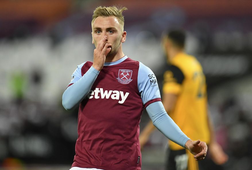 West Ham's Jarrod Bowen celebrates after scoring his team's second goal during the English Premier League soccer match between West Ham and Wolverhampton Wanderers at London Stadium, London, England, Sunday, Sept. 27, 2020. (Justin Setterfield/Pool via AP)
