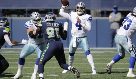 Dallas Cowboys quarterback Dak Prescott passes as Seattle Seahawks defensive end L.J. Collier blocks during the first half of an NFL football game, Sunday, Sept. 27, 2020, in Seattle. (AP Photo/John Froschauer)