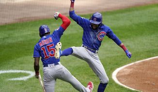 Chicago Cubs&#x27; Billy Hamilton, right, celebrates with Cameron Maybin after hitting a solo home run during the fourth inning of a baseball game against the Chicago White Sox in Chicago, Sunday, Sept. 27, 2020. (AP Photo/Nam Y. Huh)