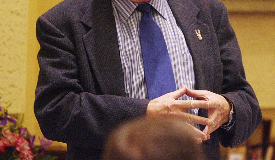 FILE - In this Feb. 14, 2007, file photo, Wyoming state Sen. Grant Larson, R-Jackson, discusses funding for the budget during an afternoon session of the Legislature in Cheyenne, Wyo. Larson had several heart surgeries in recent years. He had a lung infection in the days before he died in the house he and his family built. Grant Larson died on Sept. 11, 2020, in Jackson, Wyo. He was 87. (Michael Smith/The Wyoming Tribune Eagle via AP, File)