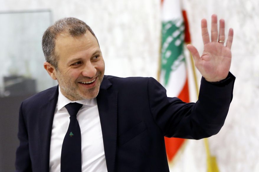 FILE - This Feb. 2, 2019 file photo, then Lebanese Foreign Minister Gebran Bassil arrives to attend a meeting of the Lebanese cabinet at the Presidential Palace in Baabda, east of Beirut, Lebanon. A former Lebanese foreign minister and son-in-law of President Michel Aoun has tested positive for the new coronavirus, his office said Sunday, Sept. 27, 2020. (AP Photo/Bilal Hussein, File)