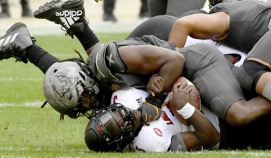 Pittsburgh defensive lineman Patrick Jones II sacks Louisville quarterback Malik Cunningham in the third quarter during an NCAA college football game at Heinz Field, Saturday, Sept. 26, 2020, in Pittsburgh. (Matt Freed/Pittsburgh Post-Gazette via AP)