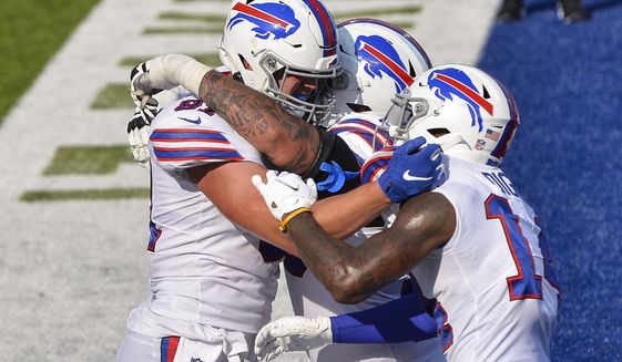 Buffalo Bills&#39; Tyler Kroft, left, celebrates with teammates after catching a pass for a touchdown during the second half of an NFL football game against the Los Angeles Rams Sunday, Aug. 26, 2018, in Orchard Park, N.Y. The Bills won 35-32. (AP Photo/Adrian Kraus)
