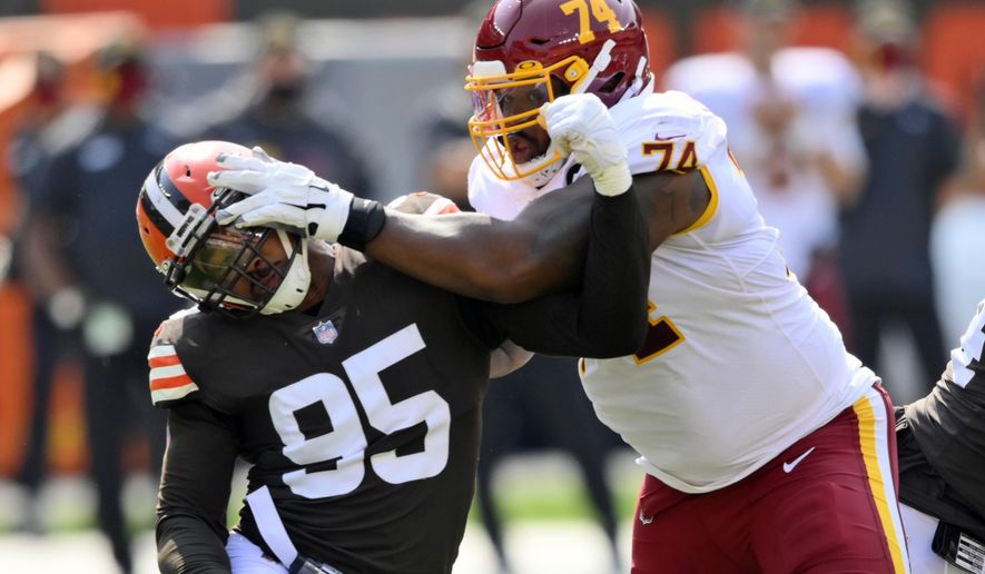 Cleveland Browns defensive end Myles Garrett (95) tries to get past Washington Football Team offensive tackle Geron Christian (74) during the first half of an NFL football game, Sunday, Sept. 27, 2020, in Cleveland. (AP Photo/David Richard)