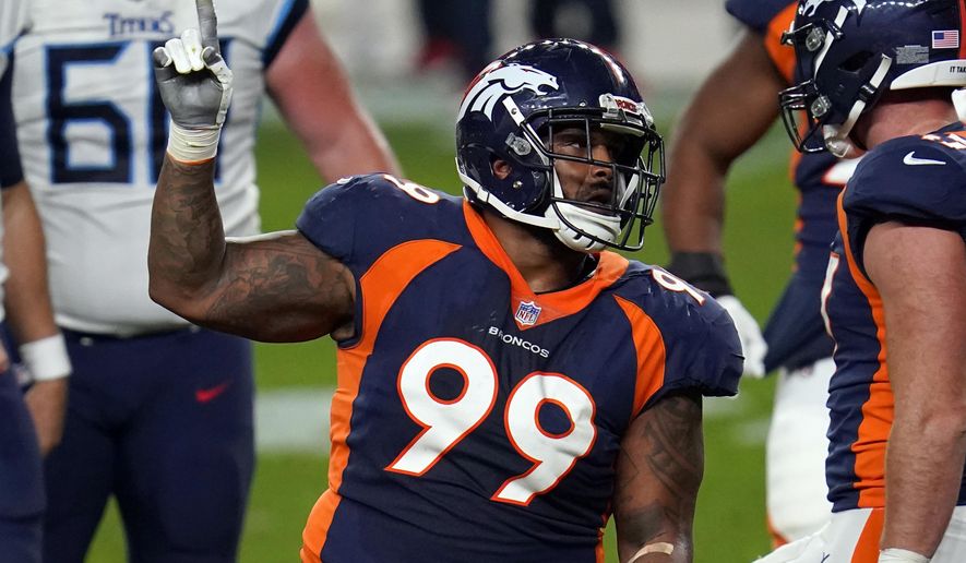 FILE - In this Monday, Sept. 14, 2020, file photo, Denver Broncos defensive end Jurrell Casey (99) gestures after a tipped pass against the Tennessee Titans during the second half of an NFL football game in Denver. The 10th-year veteran and five-time Pro Bowler tore a biceps tendon in Denver's 28-10 loss to the Tampa Bay Buccaneers on Sunday, Sept. 27, 2020. (AP Photo/David Zalubowski, File)