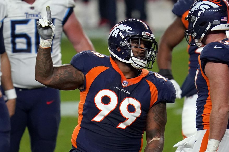 FILE - In this Monday, Sept. 14, 2020, file photo, Denver Broncos defensive end Jurrell Casey (99) gestures after a tipped pass against the Tennessee Titans during the second half of an NFL football game in Denver. The 10th-year veteran and five-time Pro Bowler tore a biceps tendon in Denver's 28-10 loss to the Tampa Bay Buccaneers on Sunday, Sept. 27, 2020. (AP Photo/David Zalubowski, File)