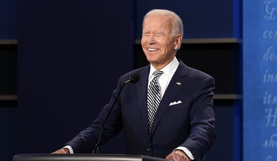 Democratic presidential candidate former Vice President Joe Biden smiles during the first presidential debate Tuesday, Sept. 29, 2020, at Case Western University and Cleveland Clinic, in Cleveland, Ohio. (AP Photo/Patrick Semansky)