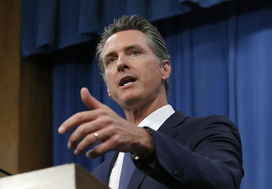 In this July 23, 2019, file photo, Gov. Gavin Newsom talks to reporters at his Capitol office in Sacramento, Calif. Newsom has vetoed a bill that would have authorized California to give low-income immigrants $600 to buy groceries. (AP Photo/Rich Pedroncelli, File)