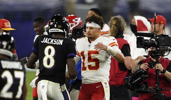 Baltimore Ravens quarterback Lamar Jackson (8) and Kansas City Chiefs quarterback Patrick Mahomes (15) embrace after an NFL football game Monday, Sept. 28, 2020, in Baltimore. The Chiefs won 34-20. (AP Photo/Gail Burton)  **FILE**